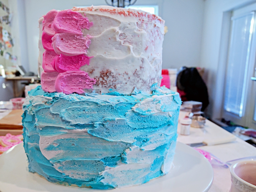 cake layers decorated to look like the ocean and a mermaid's tail