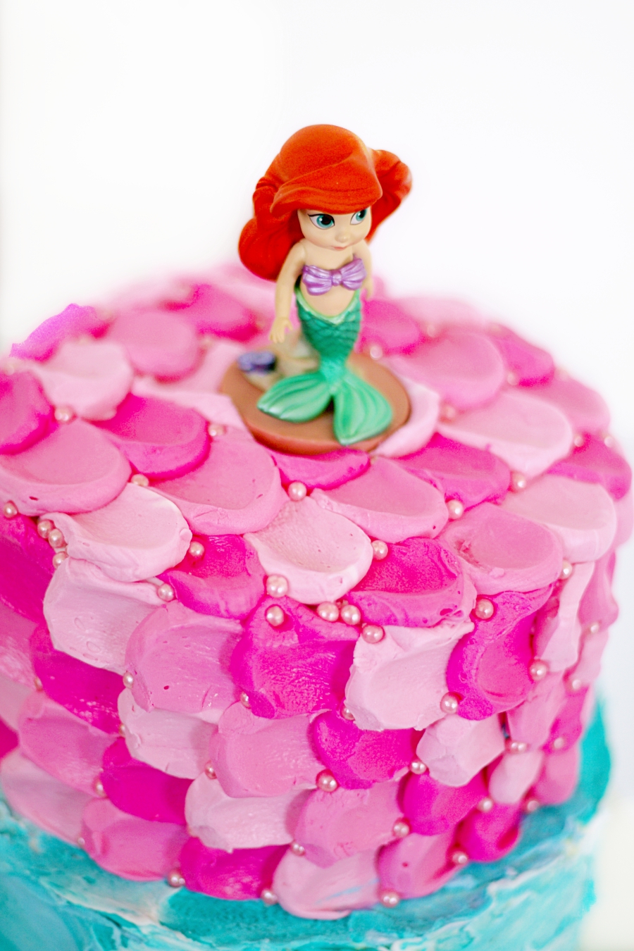 Disney's Ariel on top of mermaid cake