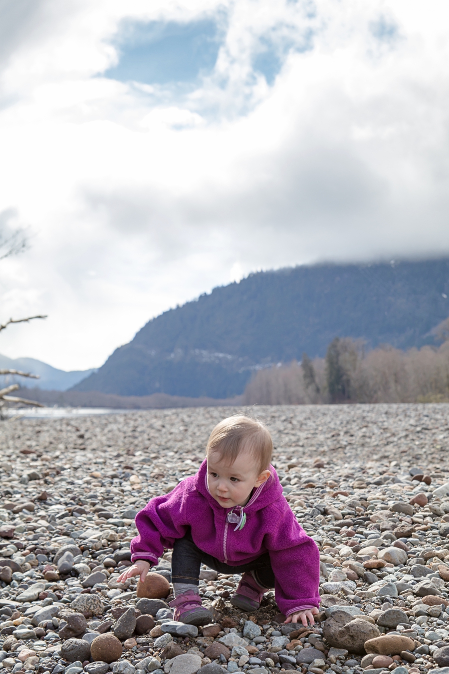Squamish River Estuary, toddler walking on riverbed 